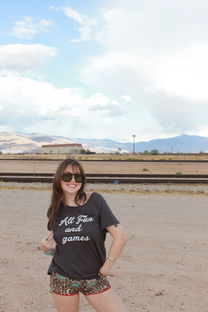 "all fun and games" tee